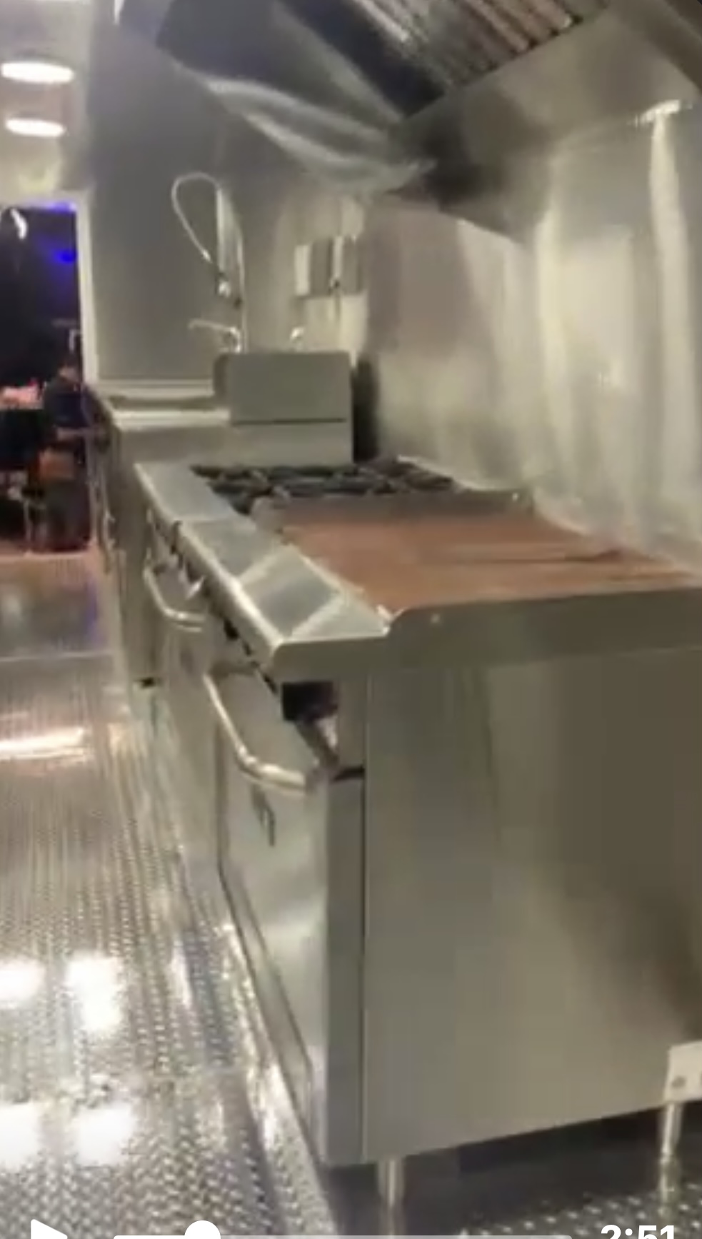 Six-burner stove and griddle under the commercial hood